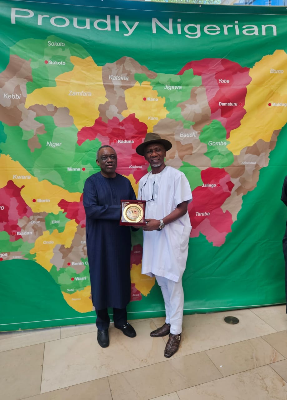 The Ambassador of Nigeria to the United States, His Excellency, Amb. Lateef Kayode Aare presenting a souvenir to Hon. (Barr.) Okey-joe Onuakalusi, the Chairman of the Nigeria-USA Parliament
