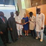 The Minority Leader of the Nigerian House of Representatives presenting an Award of Excellence to the former Governor of Delaware, United States of America, Dr. Bethany Hall-Long, during the